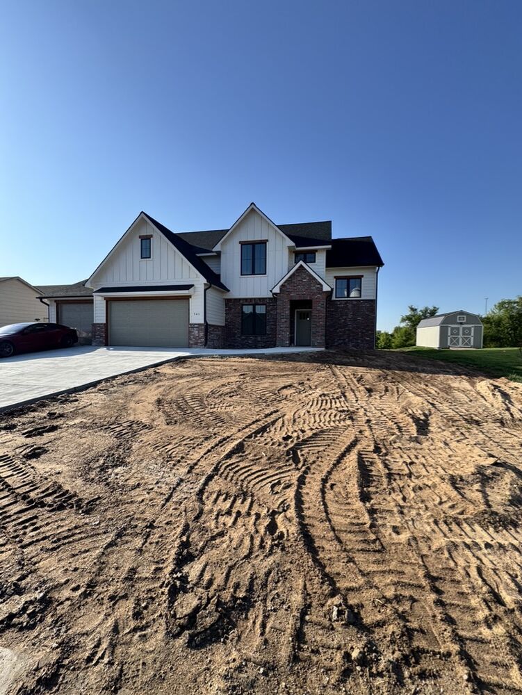 New Tallgrass build, front exterior with driveway and storage shed