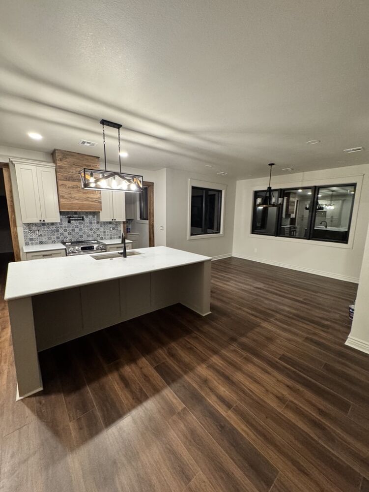 New Tallgrass build, kitchen with island and tile backsplash
