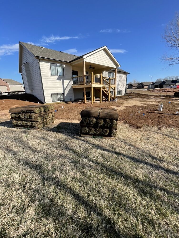 New Tallgrass build, back exterior with deck and sod pallets staged