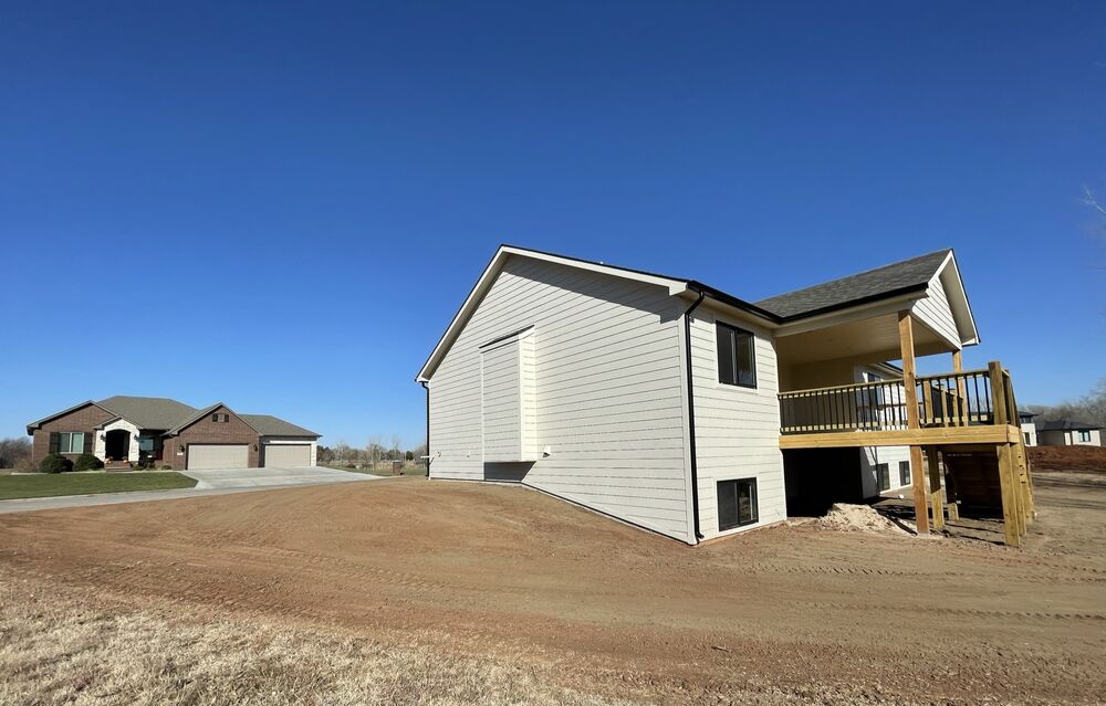 New Tallgrass build, back exterior with covered deck framed