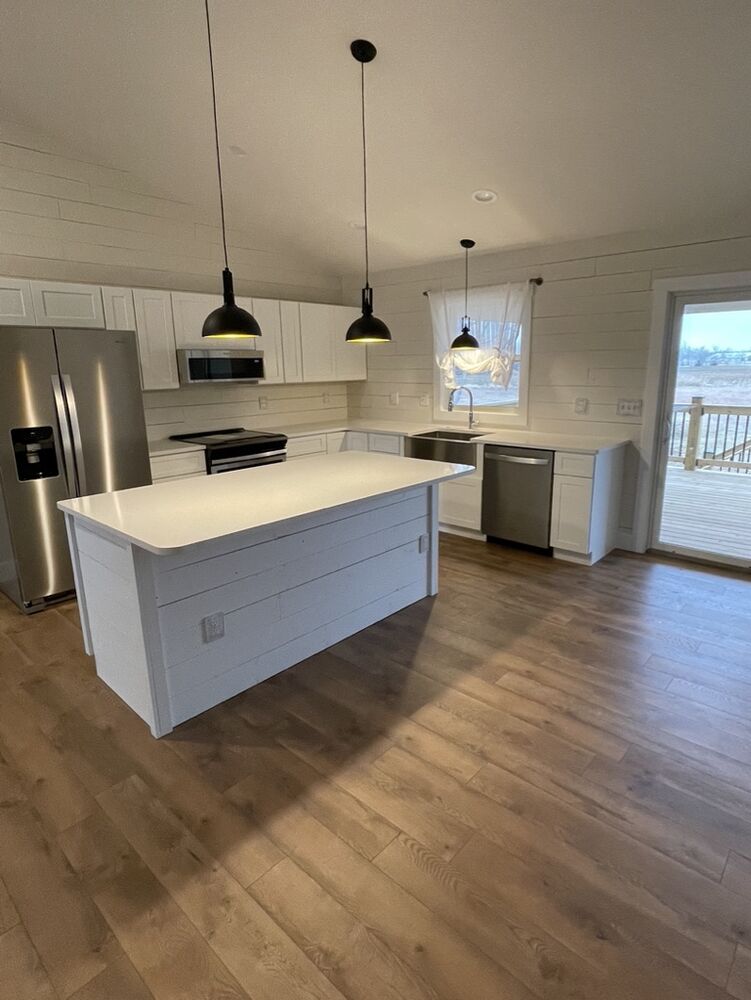 New Tallgrass build, kitchen with island and stainless appliances installed