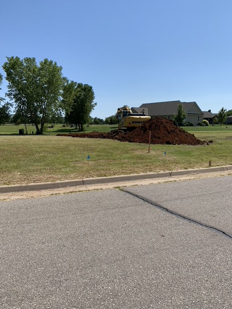 Tallgrass build site, excavator moving dirt for the foundation