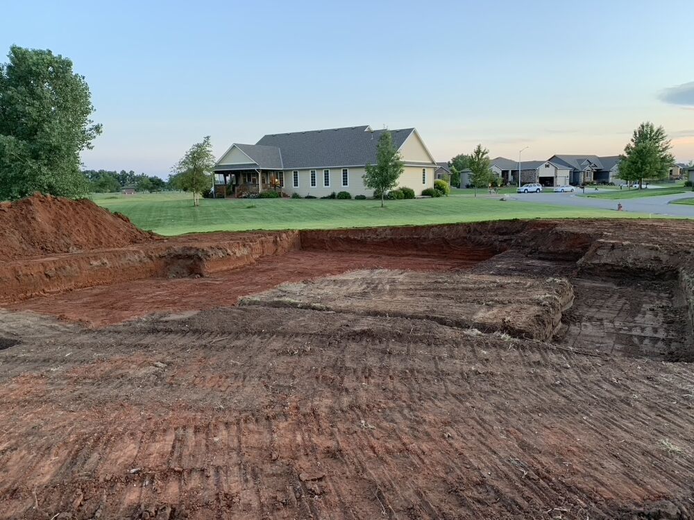 Tallgrass build site, foundation excavation dug at dusk