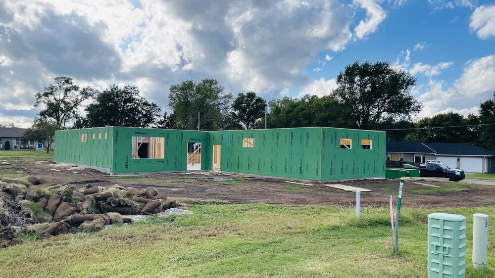 New Tallgrass build, full exterior wall sheathing wrapped on foundation
