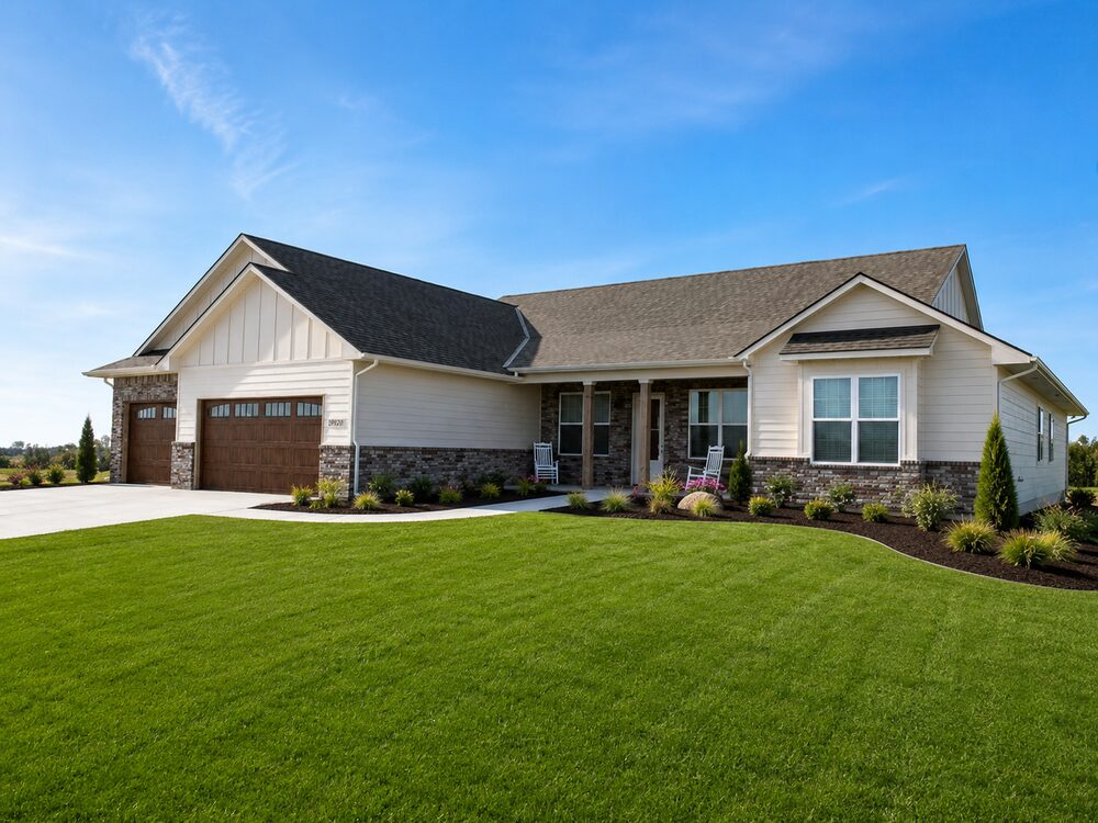New Tallgrass custom home, front exterior with covered porch and landscaping