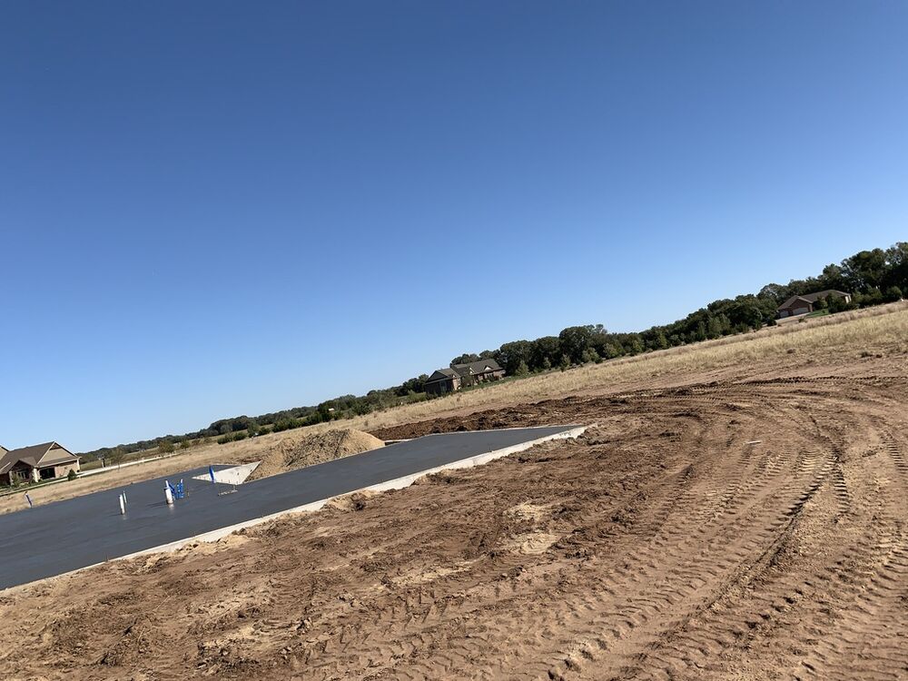 New Tallgrass build, driveway poured on the lot before framing