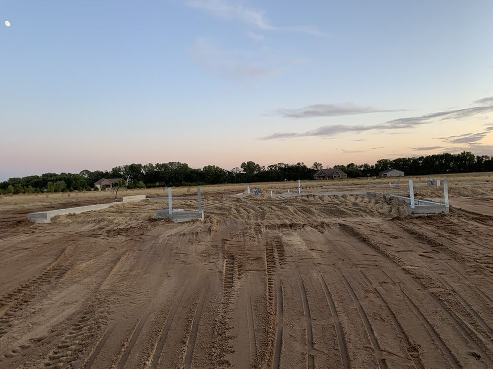New Tallgrass build, foundation footings staked at dusk